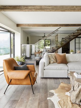 neutral living room with brown leather chair