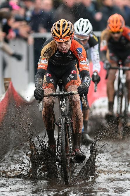 Wout Van Aert leads through the mud at Bpost Bank Trofee Azencross.