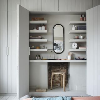 white cupboard with shelf and mirror