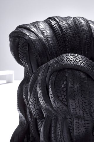 Acne Studios A/W 2024 show set with Villu Jaanisoo’s rubber tire sofas