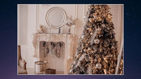 a glam and elegant white and silver toned living room with christmas decor to match