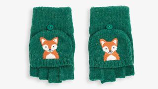 A pair of green baby mittens with fox motifs, shot on a white background