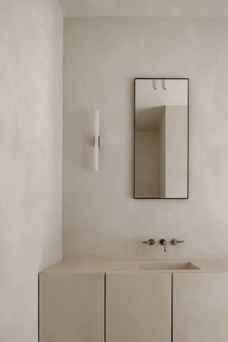 A bathroom with sleek storage