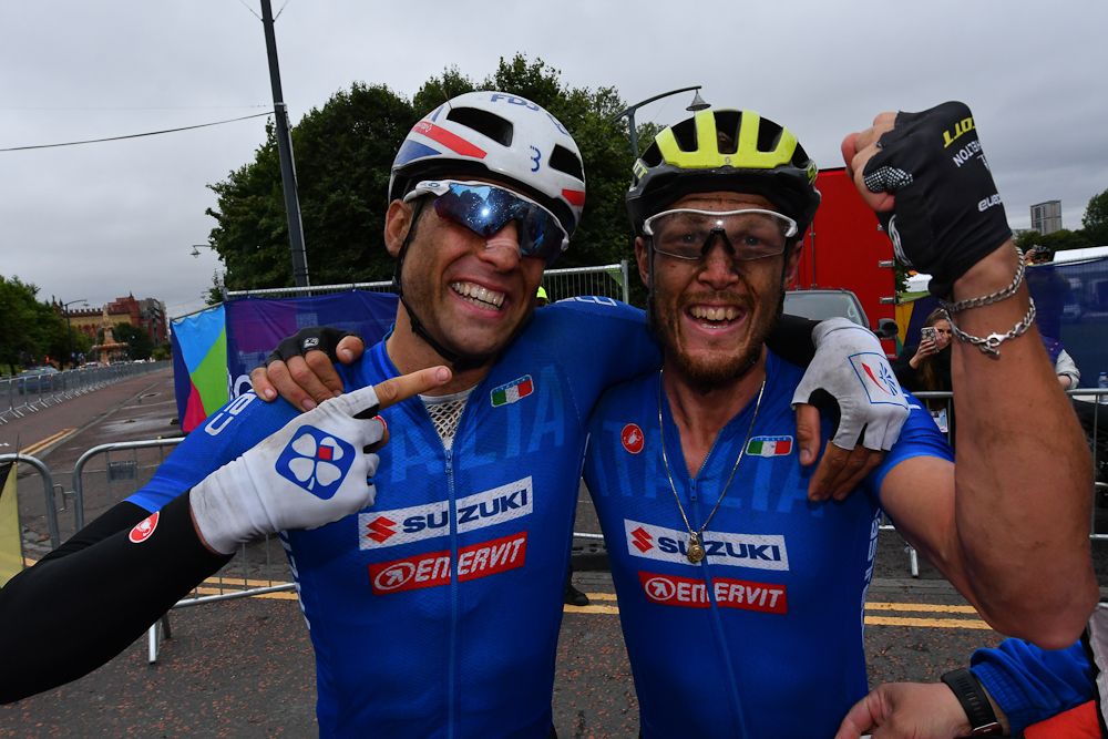 Italian teammates Davide Cimolai and Matteo Trentin celebrate after Trentin won the 2018 European championship road race