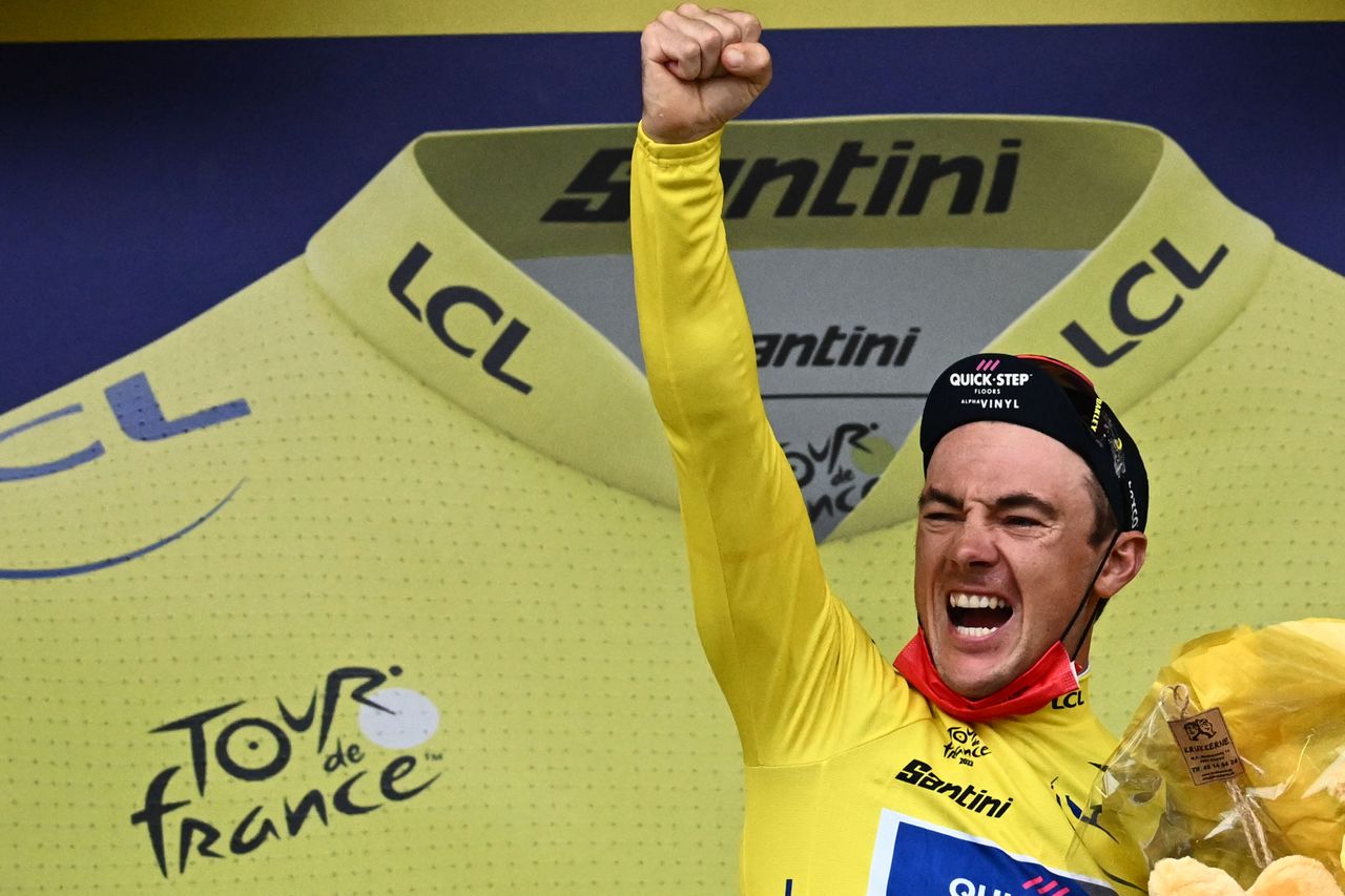 Yves Lampaert celebrates taking the yellow jersey at the Tour de France