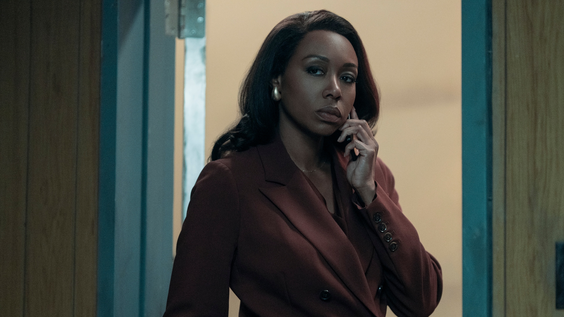 Catherine talks on the phone in The Night Agent