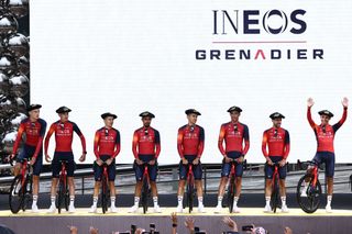 INEOS - Grenadiers' Colombian rider Egan Bernal (R) waves as he and Ineos Grenadiers team riders take to the stage during the official teams presentation in Bilbao