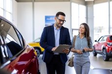A car salesman explaining an extended warranty