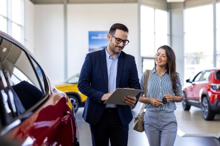 A car salesman explaining an extended warranty