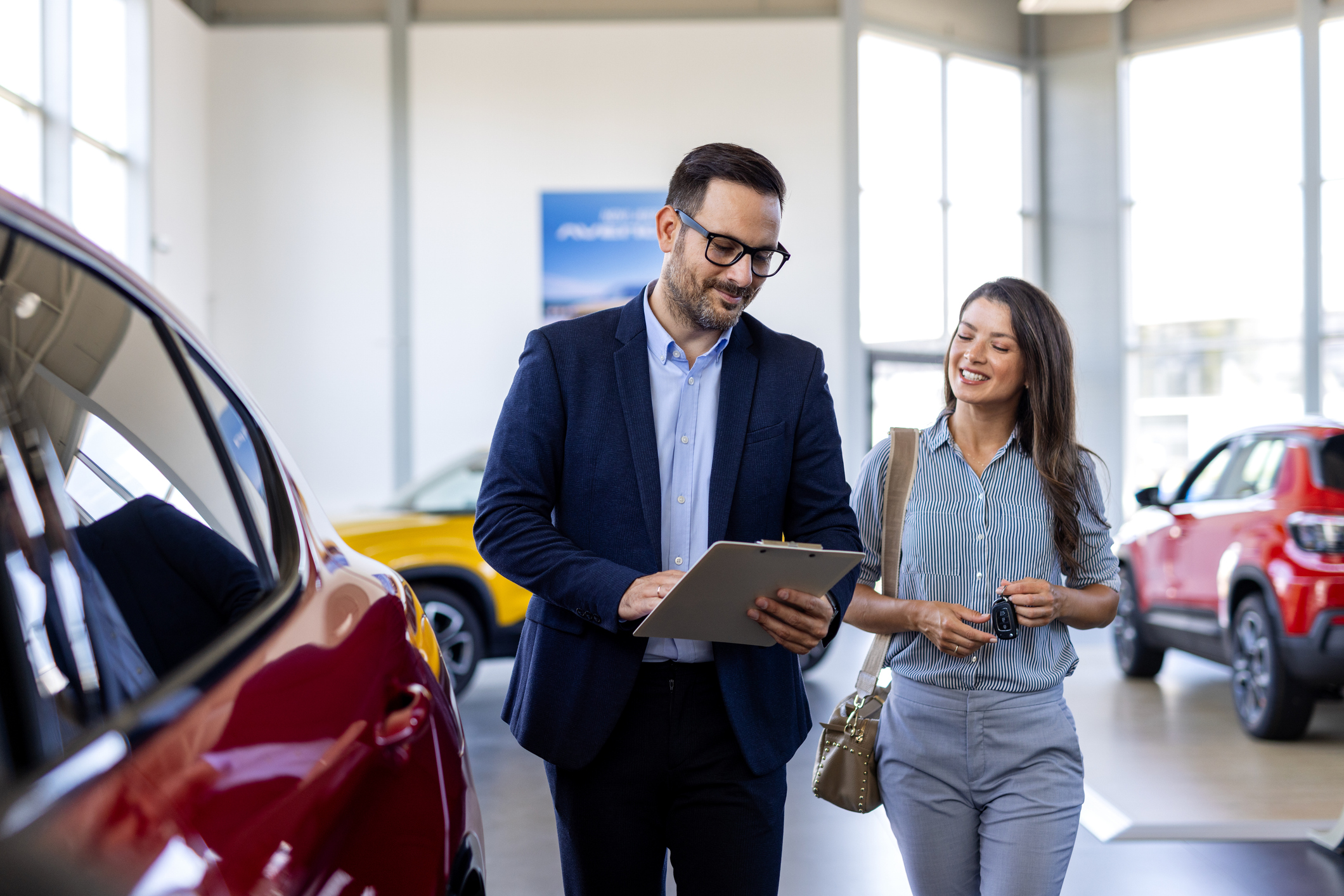 A car salesman explaining an extended warranty
