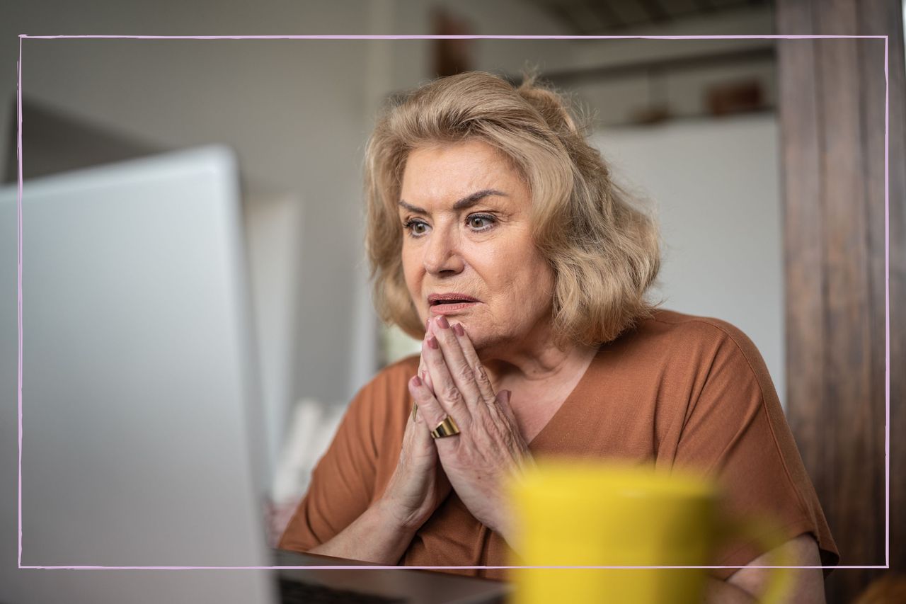 Grandparent looking upset on the computer