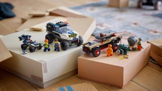 Lego Off-Road Police Car Chase set laid out on shoeboxes