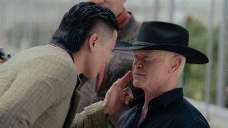 Rich Ting as Ming and Neal McDonough as Cal Thresher in a tense moment in Tulsa King season 2 episode 8