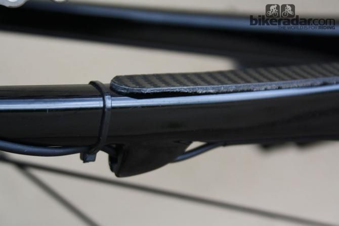 With a cable tie, the mechanics make use of the mechanical gear lug to hold the electronic wiring