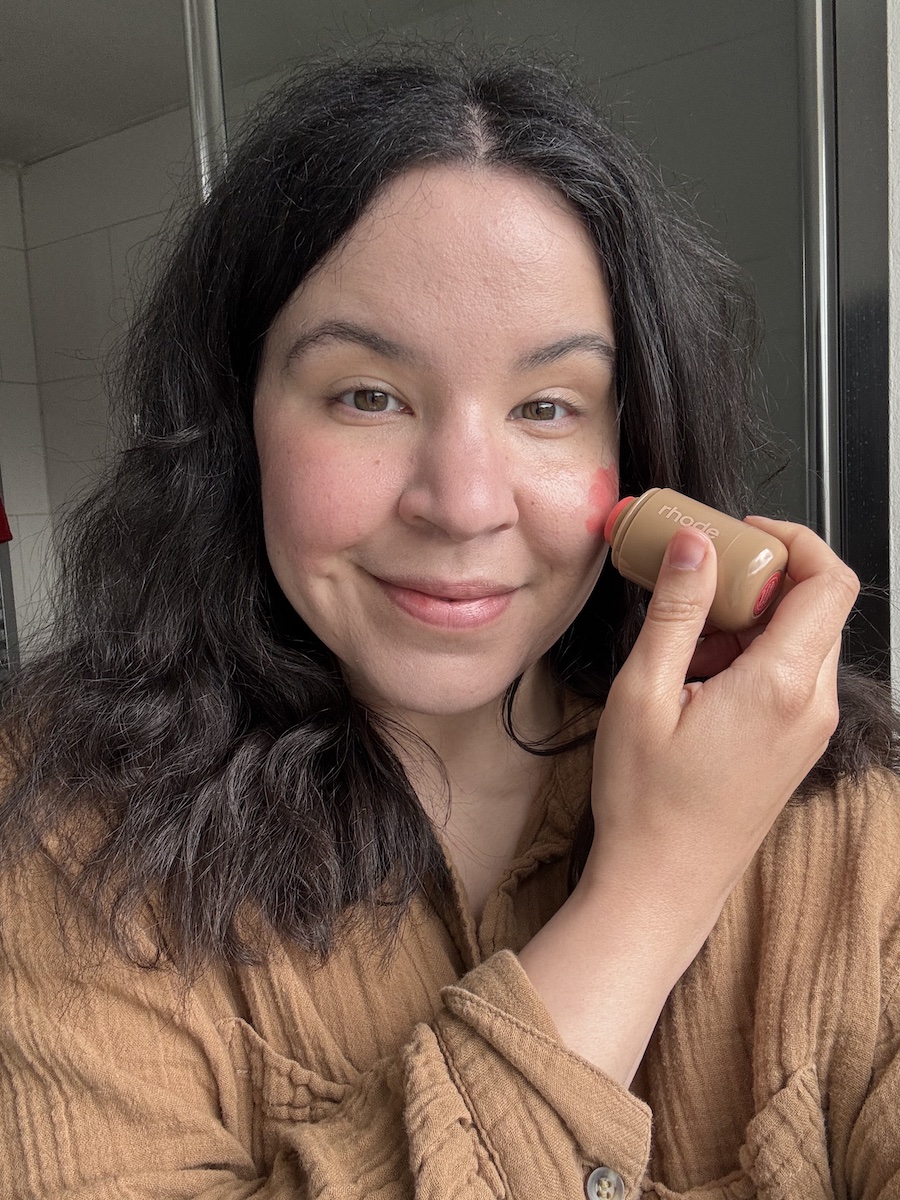 Mica Ricketts applying cream blush