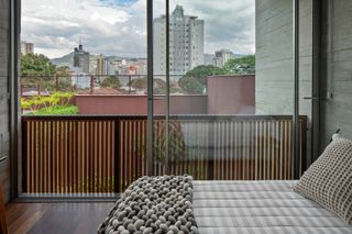 Bedroom and view of the city at Belo Horizonte home