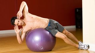 Gym ball oblique crunch