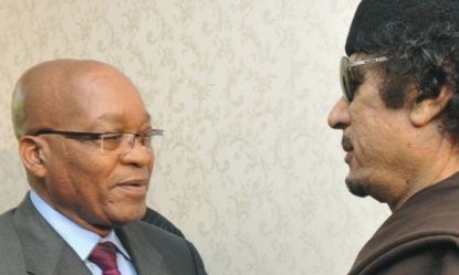 South African President Jacob Zuma greets Libyan leader Moammar Gadhafi on Monday, before a meeting in which Zuma tried to broker a peace deal.
