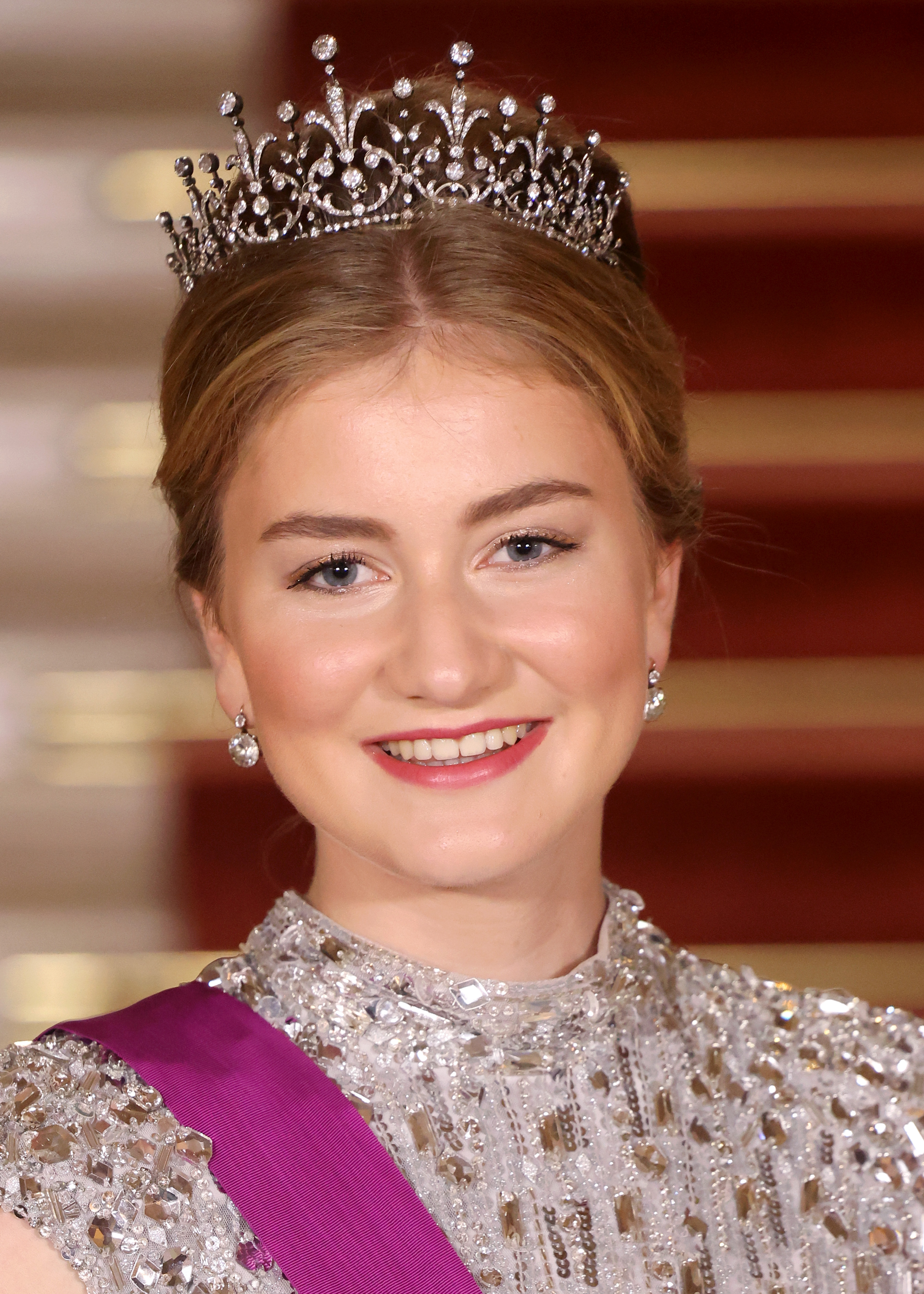 Princess Elisabeth smiling wearing a sequined dress and tiara