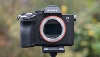 Sony A7 V camera from the front, on a tripod outside