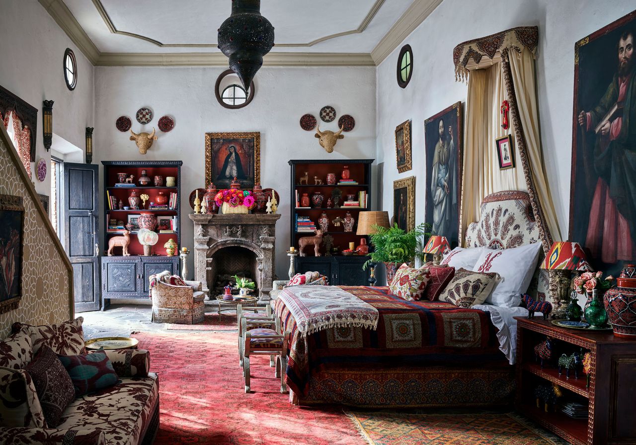 Traditional bedroom with fireplace and cabinets