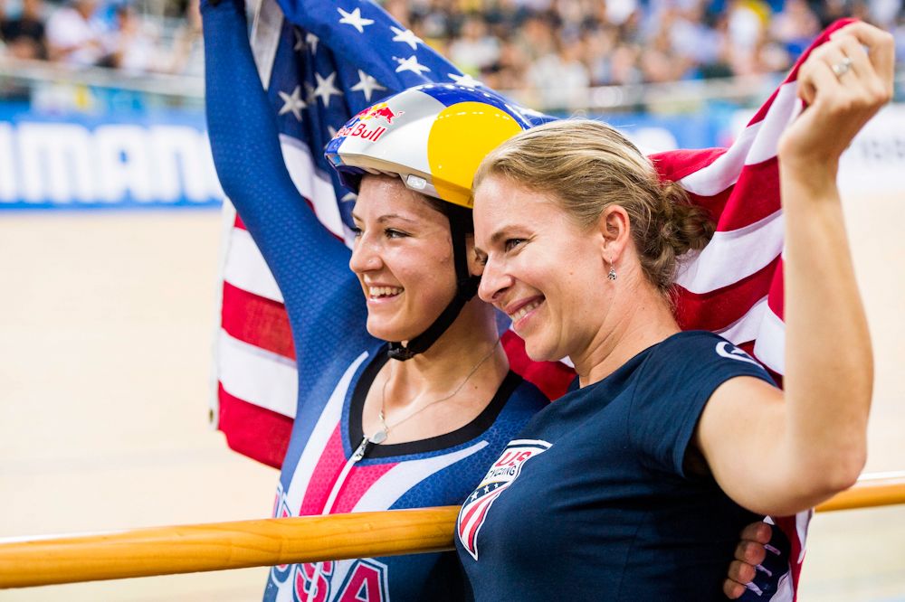 Chloe Dygert and Sarah Hammer celebrate Dygert's first rainbow jersey in the individual pursuit