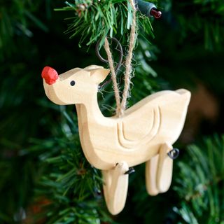 wooden toy hanging on tree