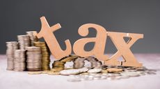 the word tax falling on pile of coins for high sales tax states