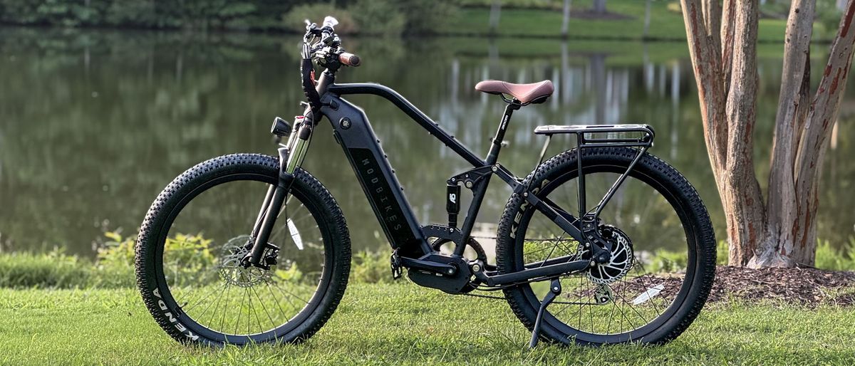 Mod Bikes Black 3 in a park by a lake