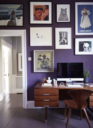 gallery wall ideas with funky mix of art against purple walls