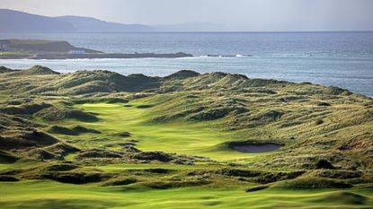 The seventh at Royal Portrush is a new hole that runs through the towering dunes. Image provided by Rob Smith, credit to Getty.