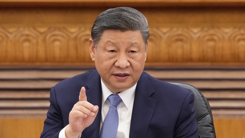 Xi Jinping pointing a finger up