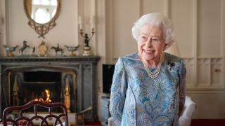 Britain's Queen Elizabeth II reacts during an audience with Switzerland's President Ignazio Cassis (unseen) at Windsor Castle, west of London on April 28, 2022.