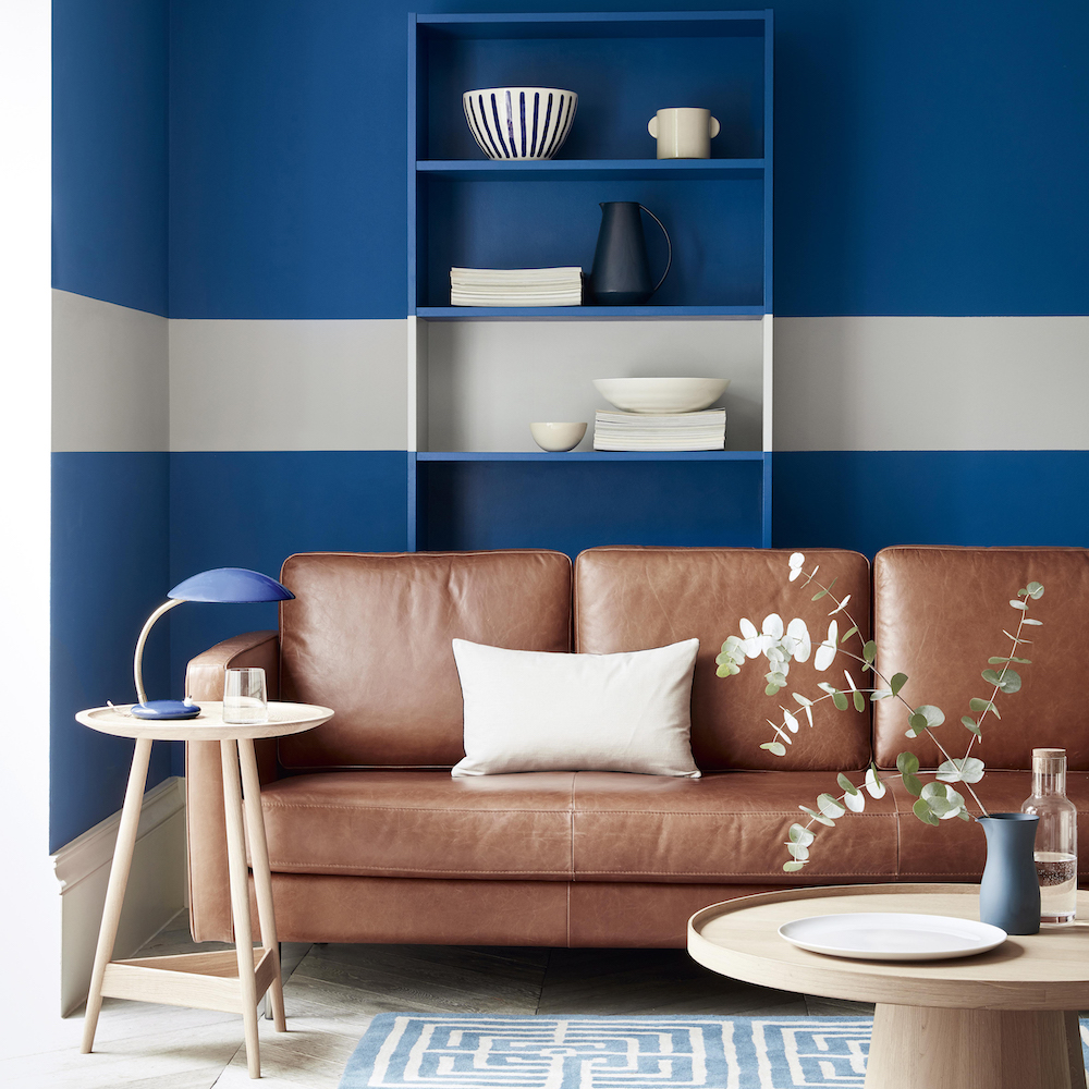 Living room feature wall with blue and cream horizontal striped wall