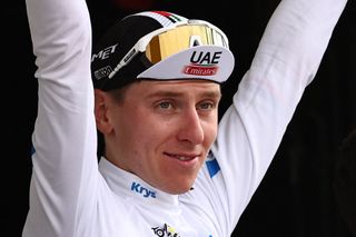 UAE Team Emirates' Slovenian rider Tadej Pogacar celebrates on the podium with the best young rider's white jersey after the 16th stage of the 110th edition of the Tour de France cycling race, 22 km individual time trial between Passy and Combloux, in the French Alps, on July 18, 2023. (Photo by Anne-Christine POUJOULAT / AFP)