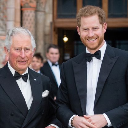 Prince Harry and King Charles wearing tuxedos standing next to each other