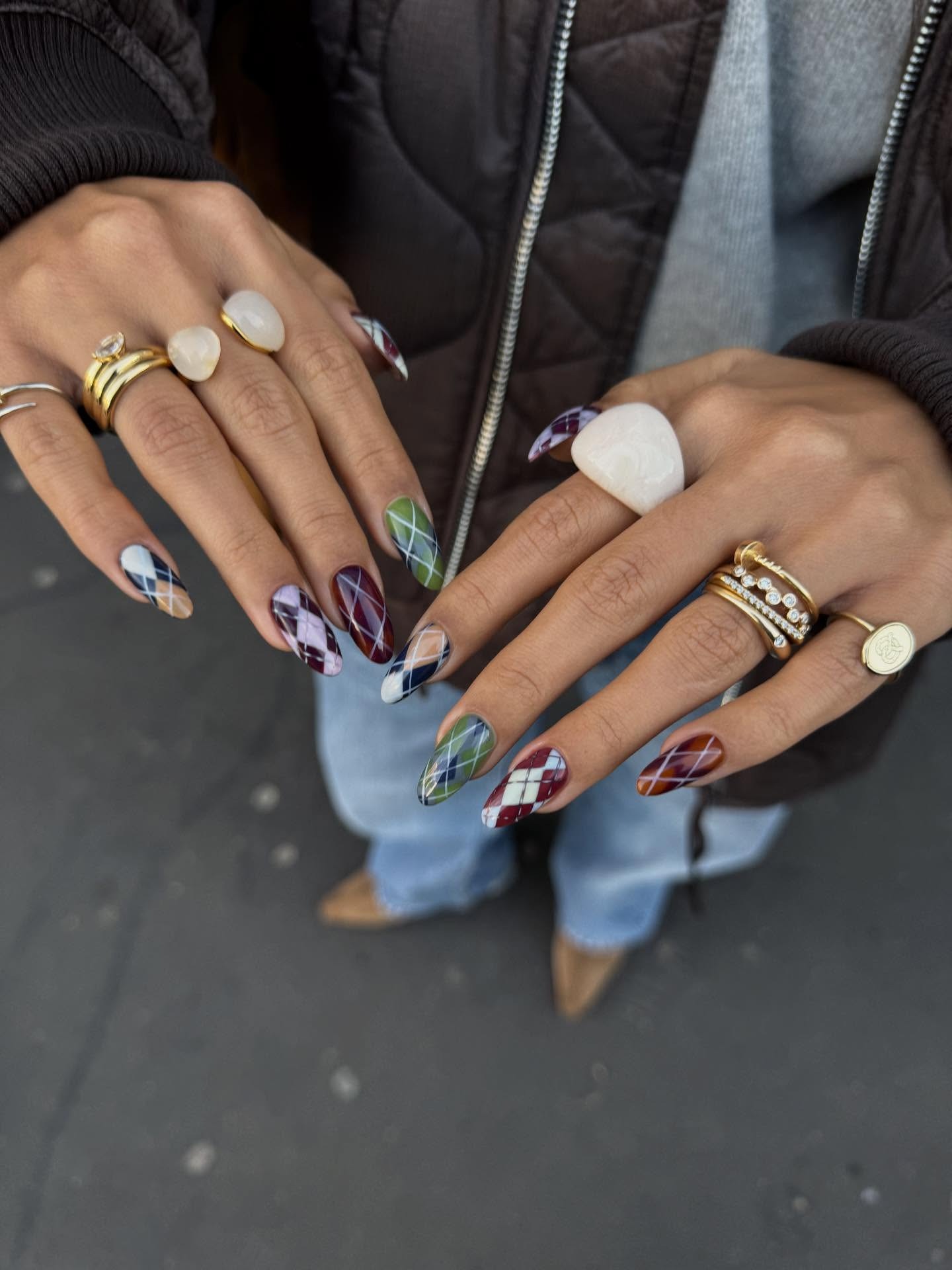 An image of mismatched argyle nails.