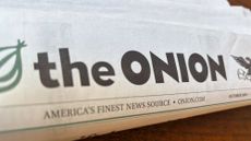 A copy of The Onion newspaper is displayed.