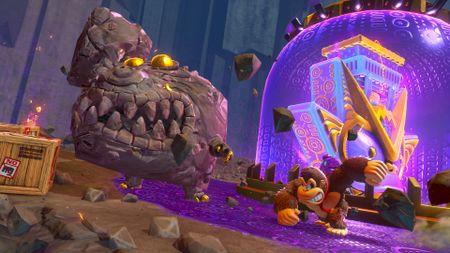 Donkey Kong punches a rock enemy in the face in Donkey Kong Bananza with a large purple glowing area in the background
