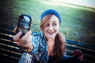 teen girl takes selfie