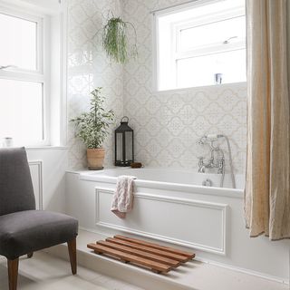 white bathroom with bath and shower curtain