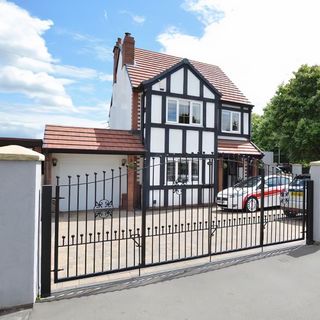 detached house with metal gate