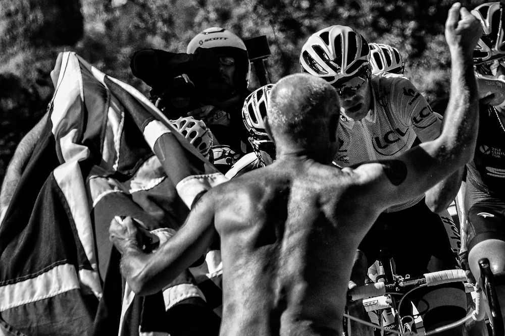 Chris Froome makes his way through the crowd on l'Alpe d'Huez.