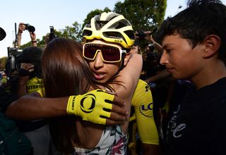 Egan Bernal (Team Ineos) celebrates with his family at the end of the Tour de France