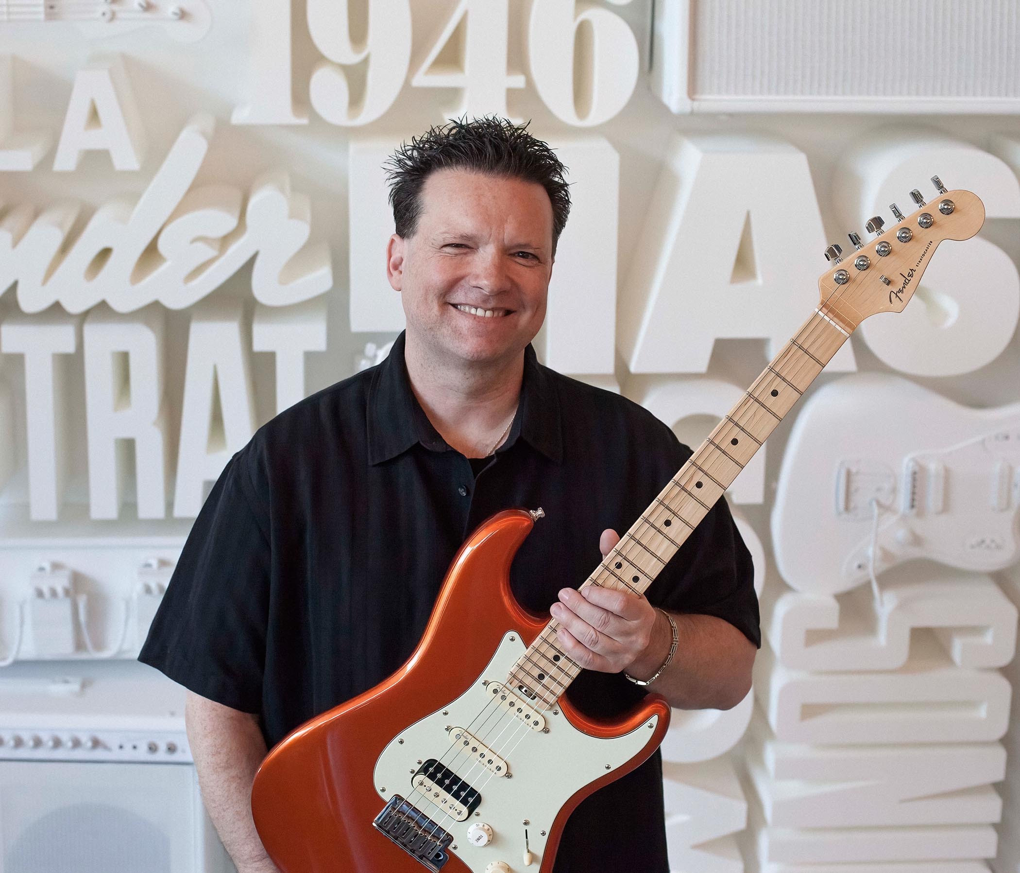 Fender&#039;s chief product officer Max Gutnik holds an HSS Stratocaster