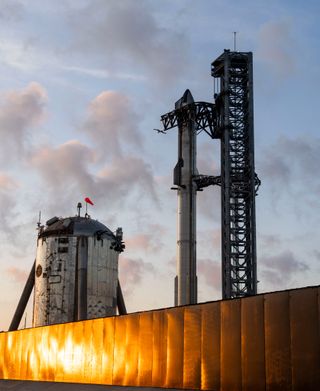SpaceX's Starship sits on its launch pad at sunrise