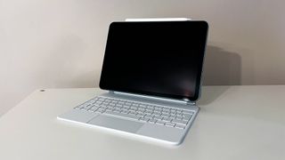 iPad Air 5th Gen on white table with Magic Keyboard accessory