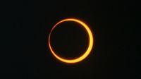 a ring of orange against a black background.