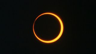 a ring of orange against a black background.