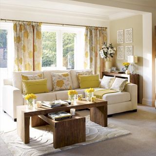 living room with coffee table and curtain